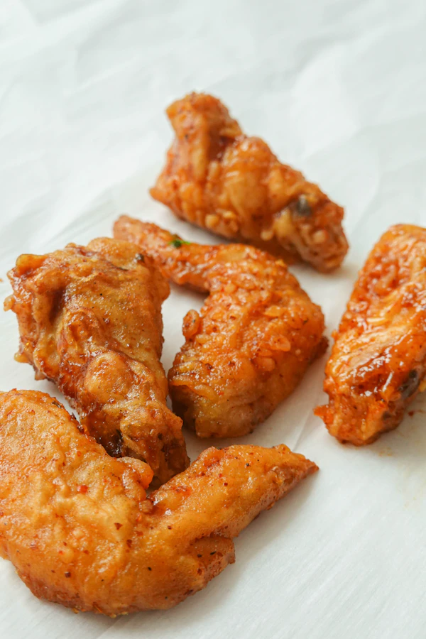 A plate of crispy Korean fried chicken wings
