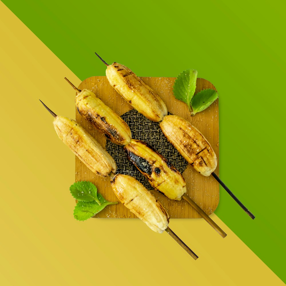 grilled banana on green leaf