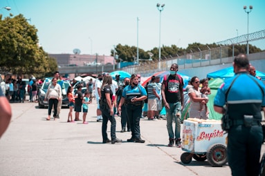 people standing on gray concrete pavement during daytime