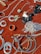 A collection of jewelry and accessories spread on a red velvet surface. Various items include earrings, rings, necklaces, and bracelets in different designs and colors such as silver, gold, and black. Some pieces have gemstone embellishments, while others have intricate metalwork.