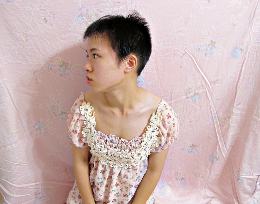 woman in white and brown floral dress