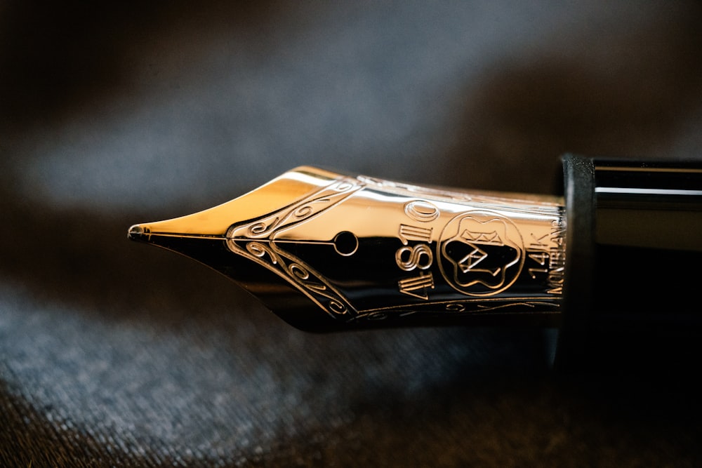 gold and silver fountain pen