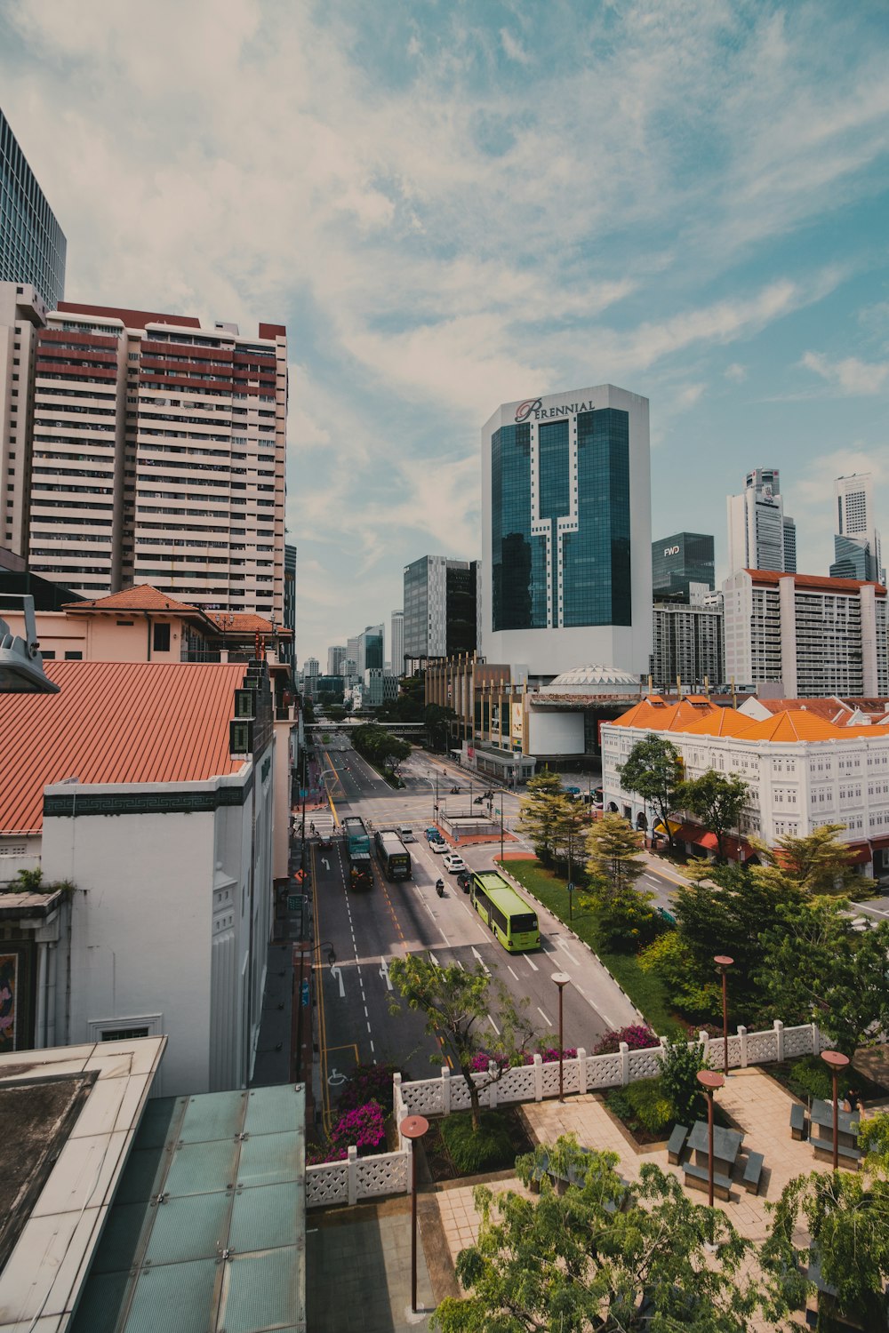 city with high rise buildings under white clouds during daytime