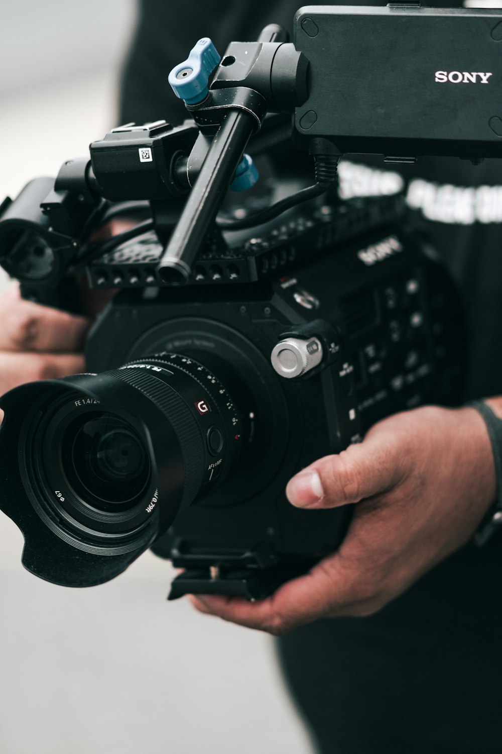 person holding black dslr camera