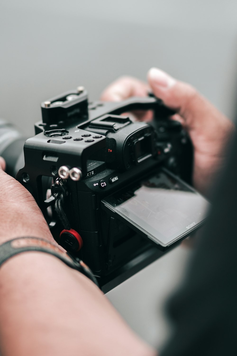 person holding black video camera