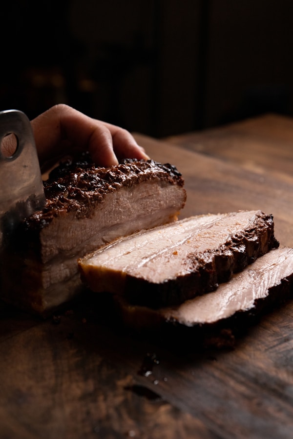 Person holding sliced of bread
