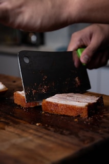 sliced bread on brown wooden chopping board