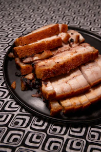 brown and black bread on black ceramic plate