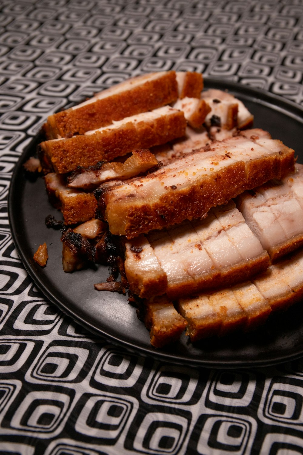 brown and black bread on black ceramic plate