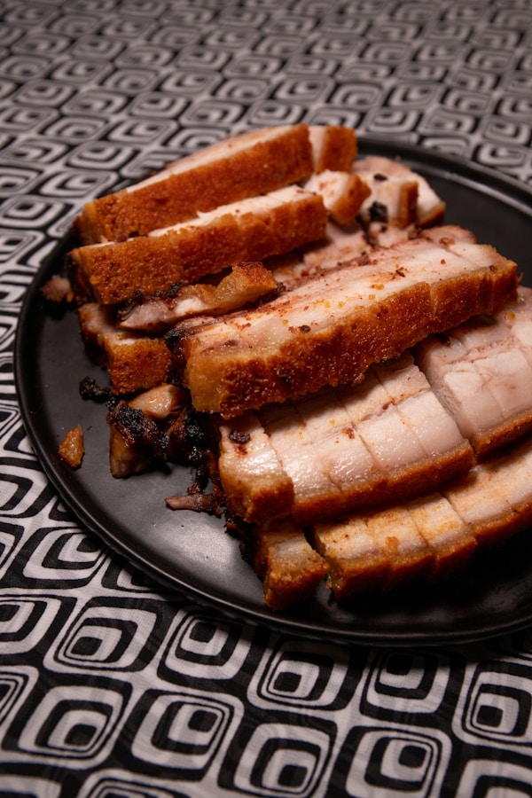 Brown and black bread on black ceramic plate