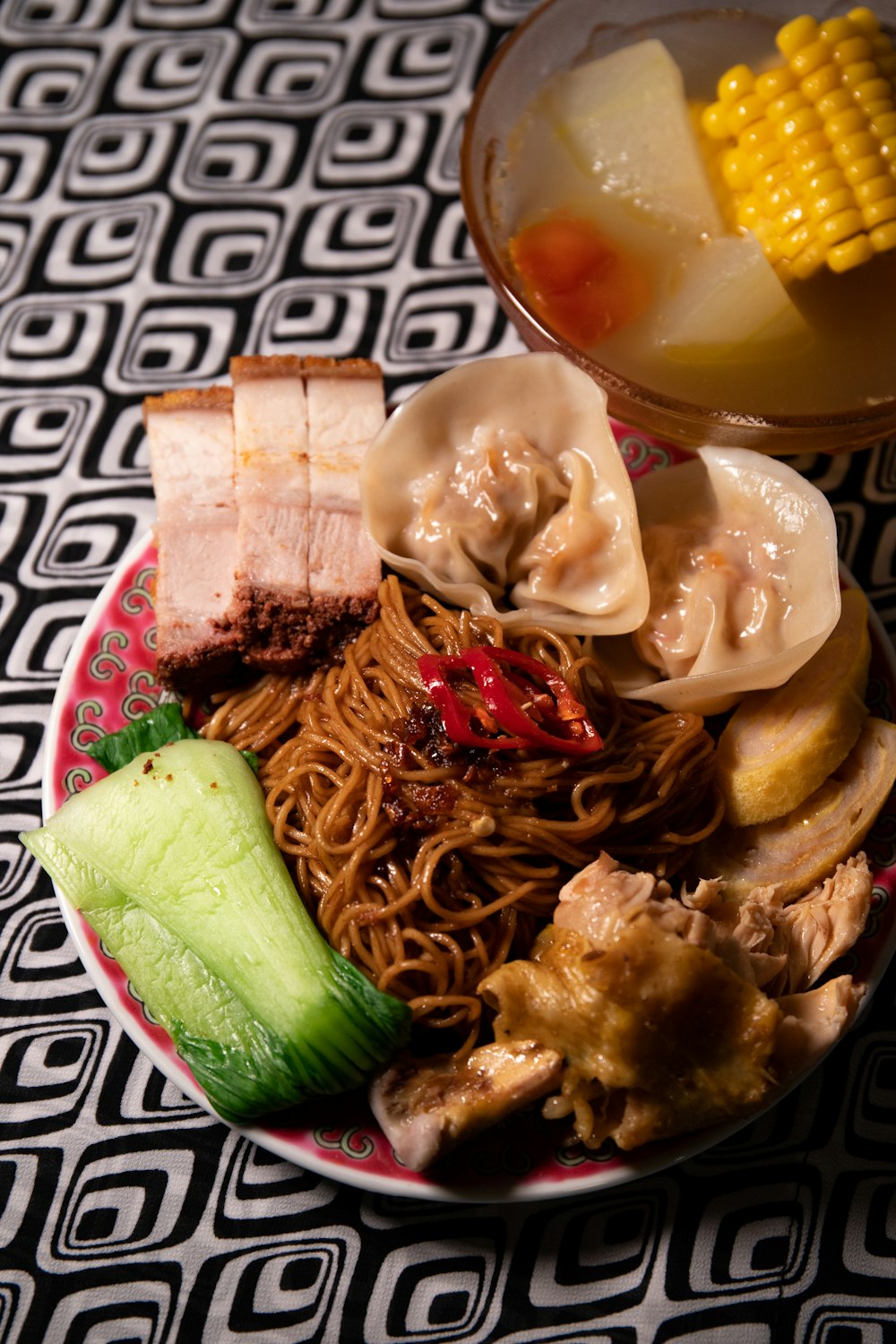 pasta with meat and vegetable on white ceramic bowl