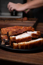 sliced bread on black plate