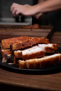 sliced bread on black plate