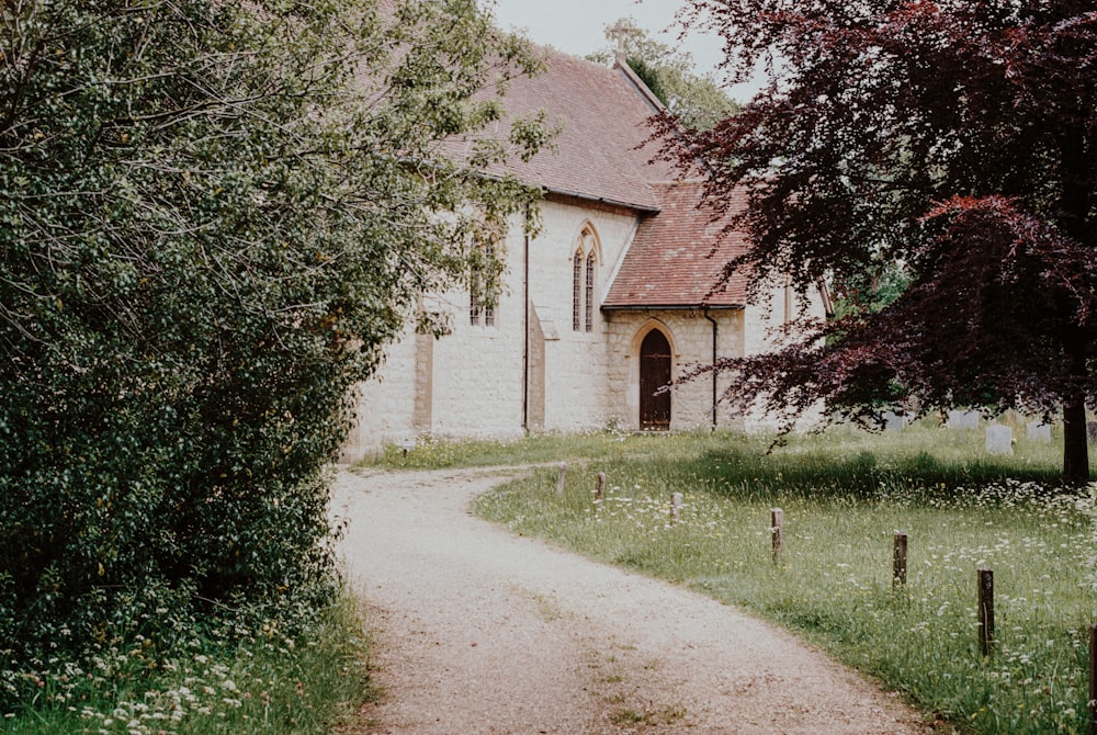 brown brick building near green trees during daytime