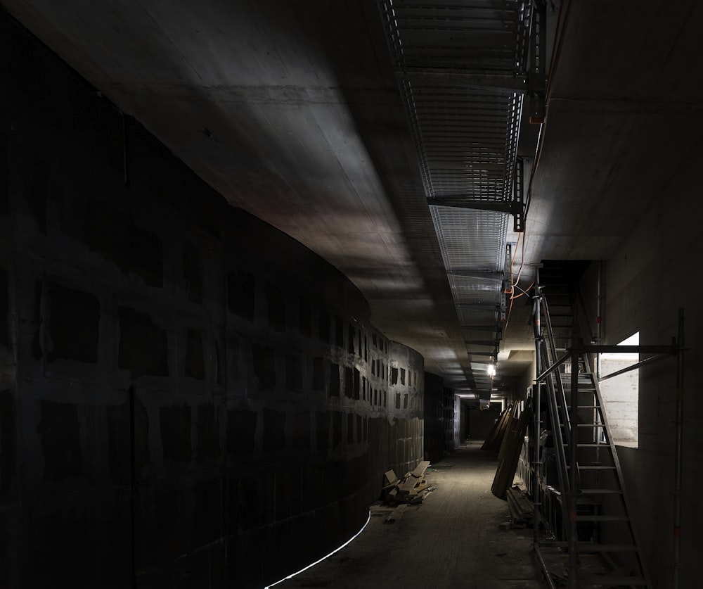 black and white tunnel with stairs