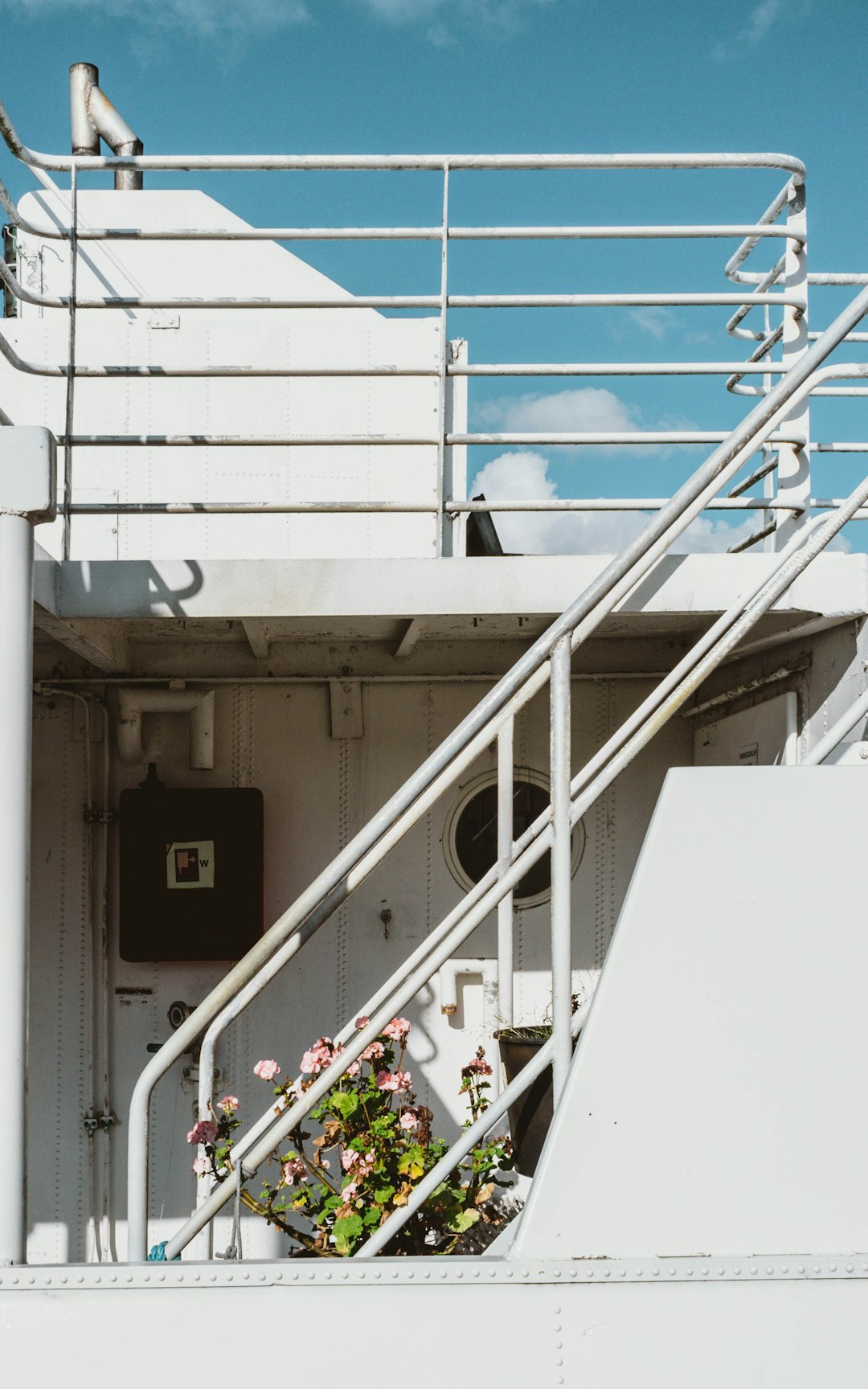 white metal railings on white concrete building