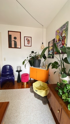 a living room with a lot of plants on the wall