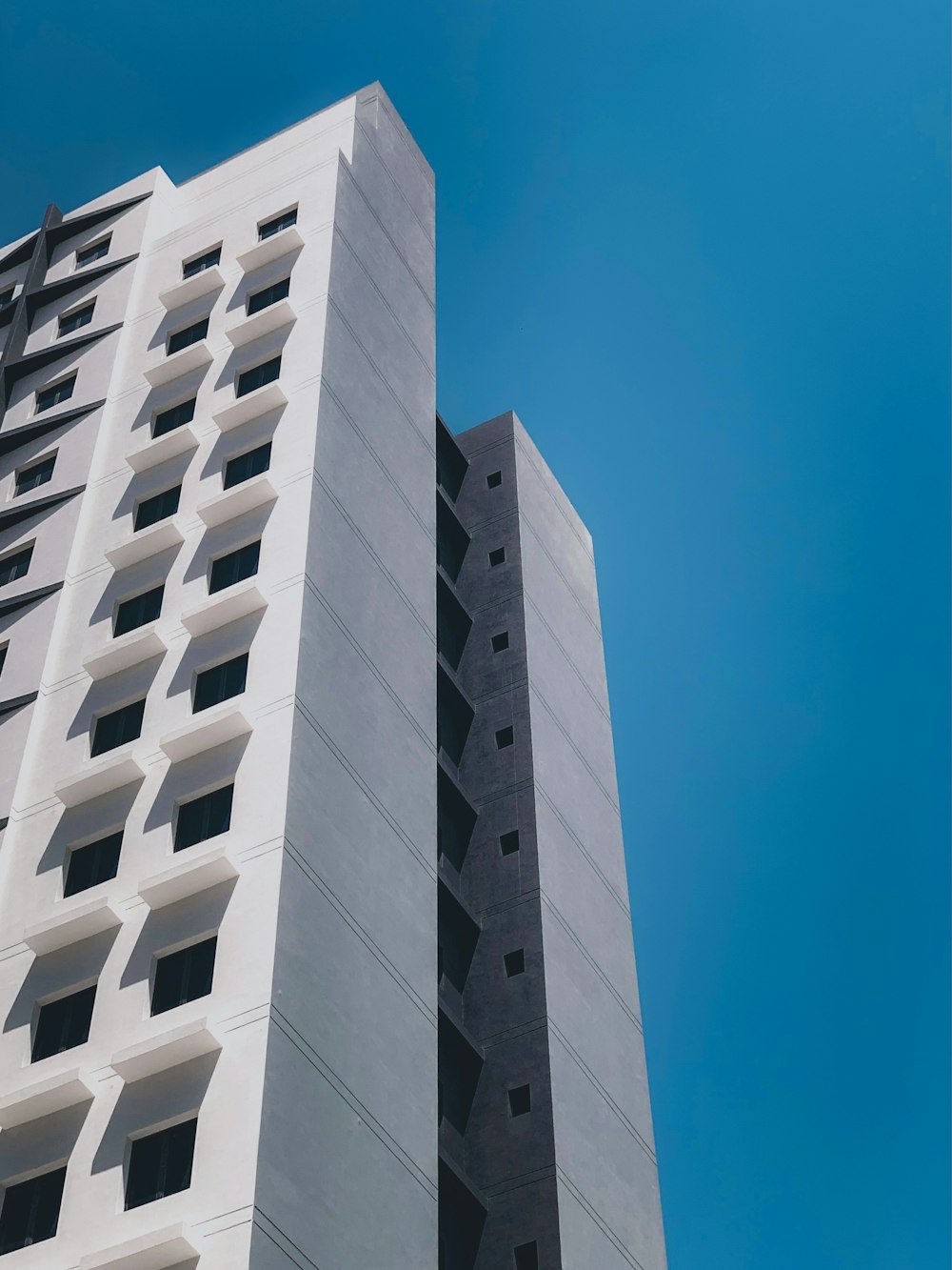 white concrete building under blue sky during daytime