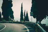 A dynamic shot of a cyclist in motion on a coastal road.
