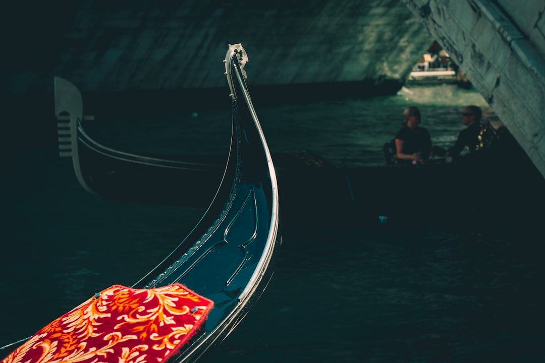 man in black shirt riding on boat