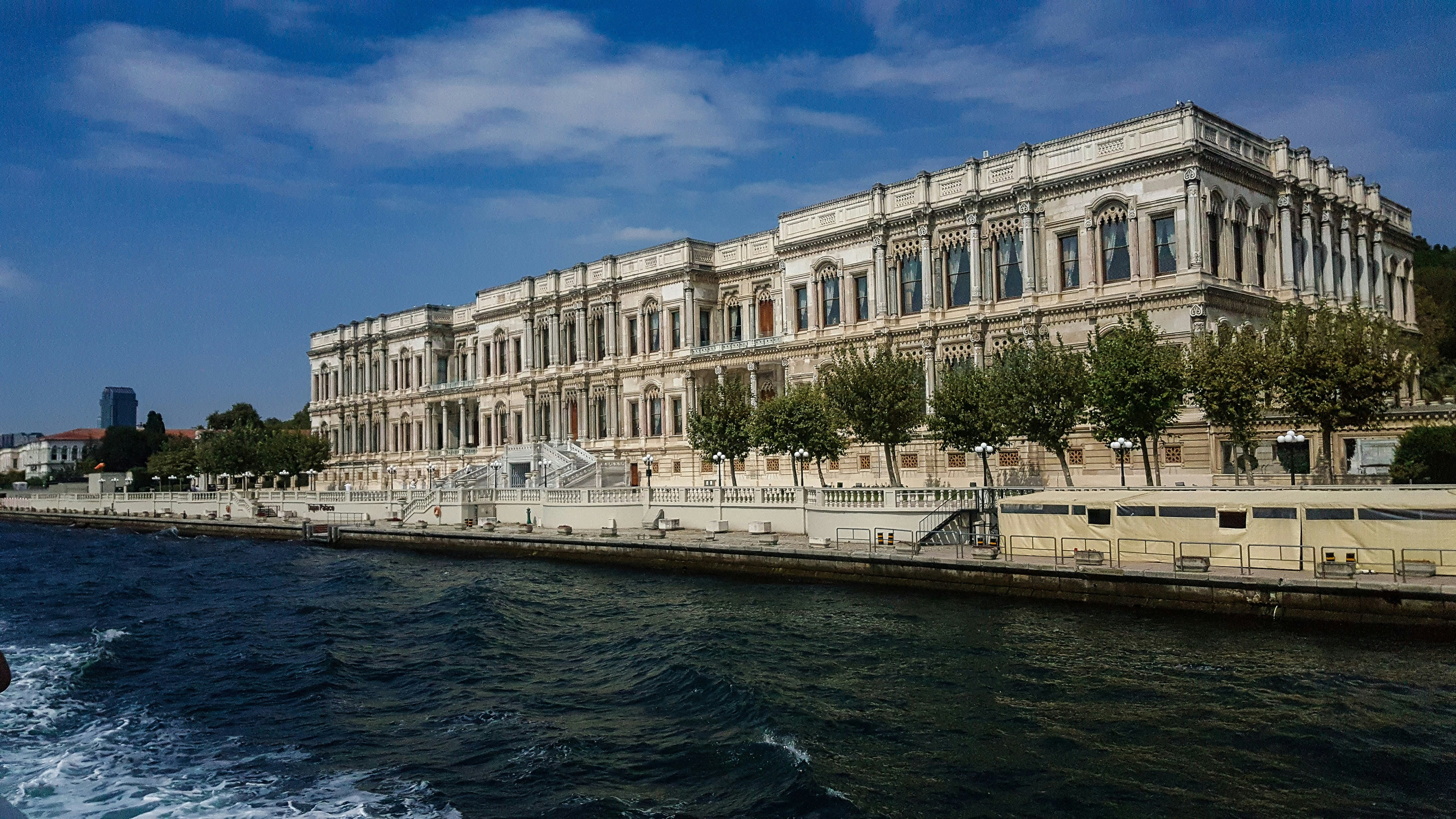 white concrete building near body of water during daytime
