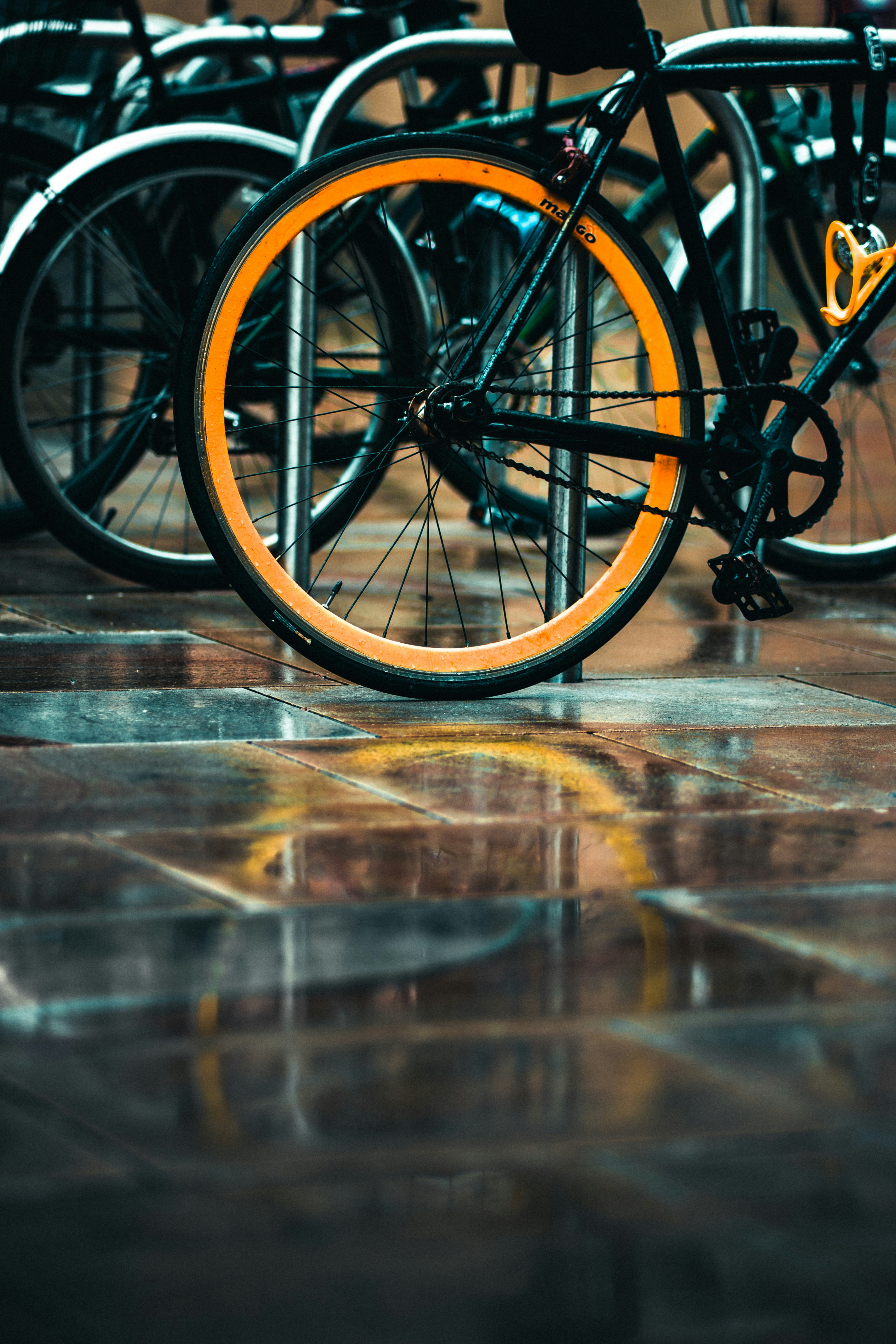 black and yellow bicycle on brown wooden floor
