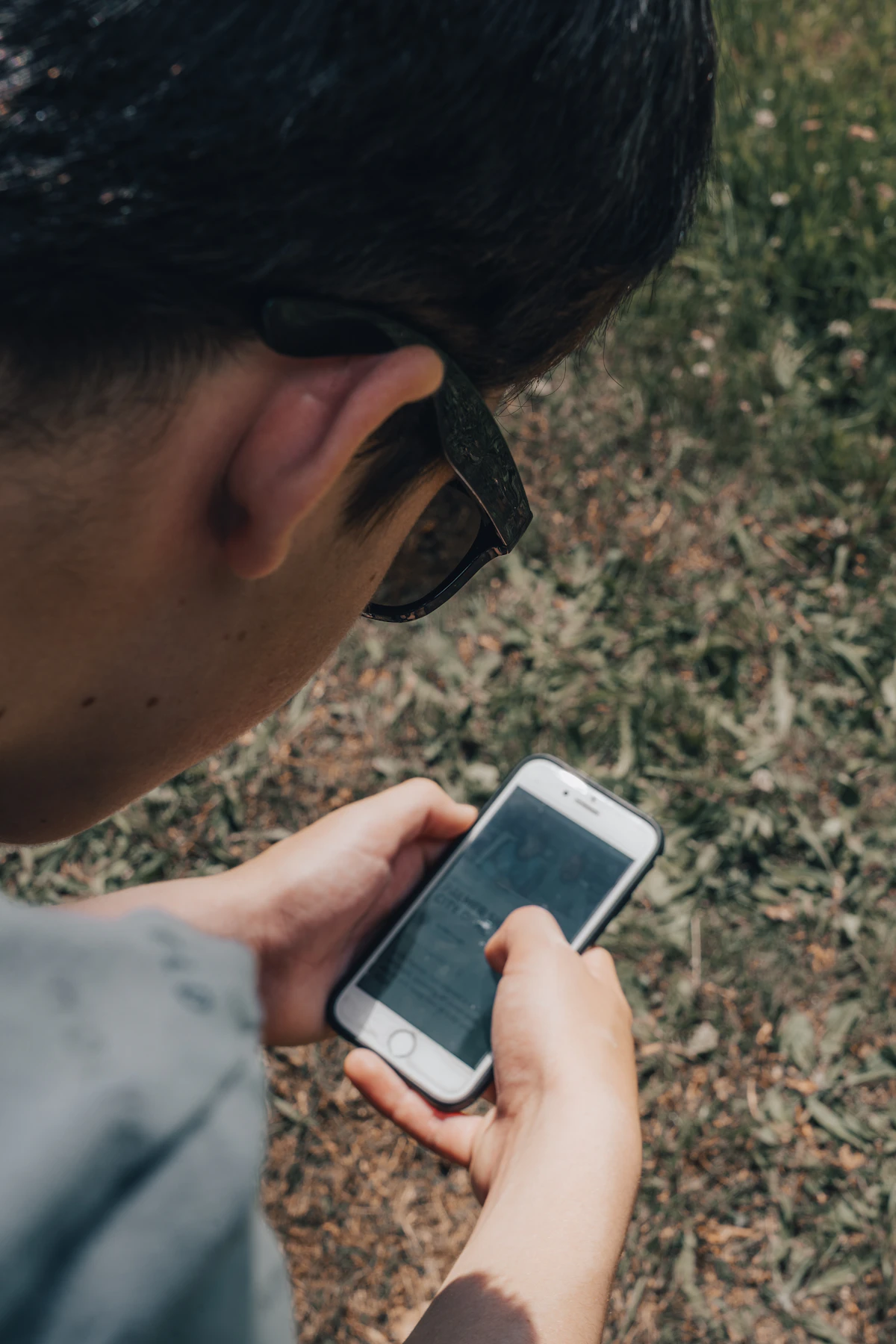 Person using a smartphone to search, representing how social search levels the playing field for local business owners competing for discovery