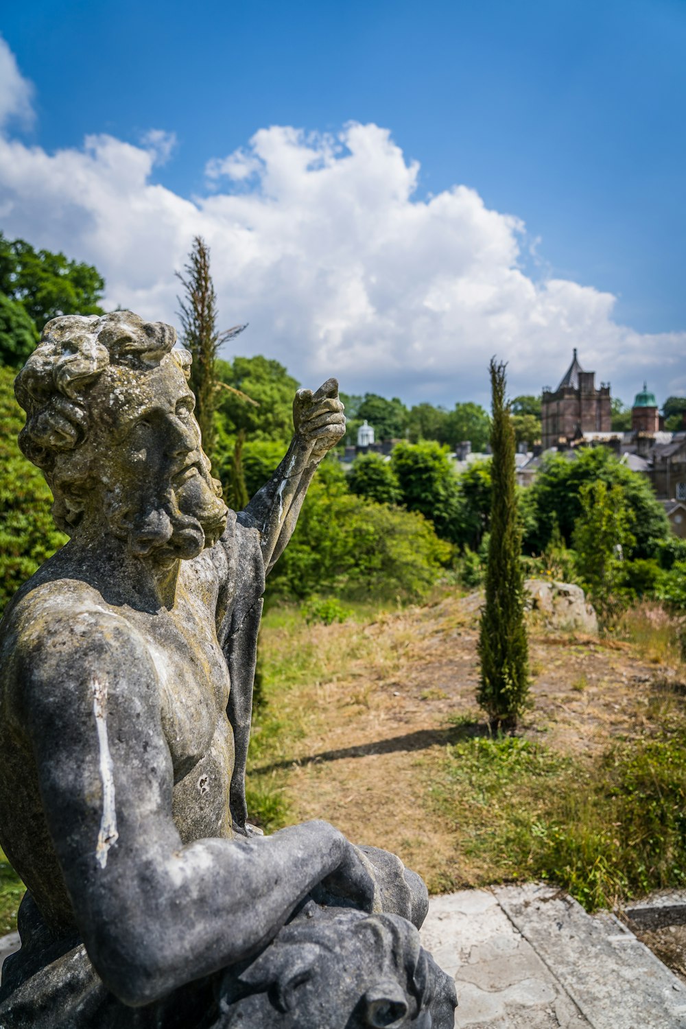 gray concrete statue under blue sky during daytime