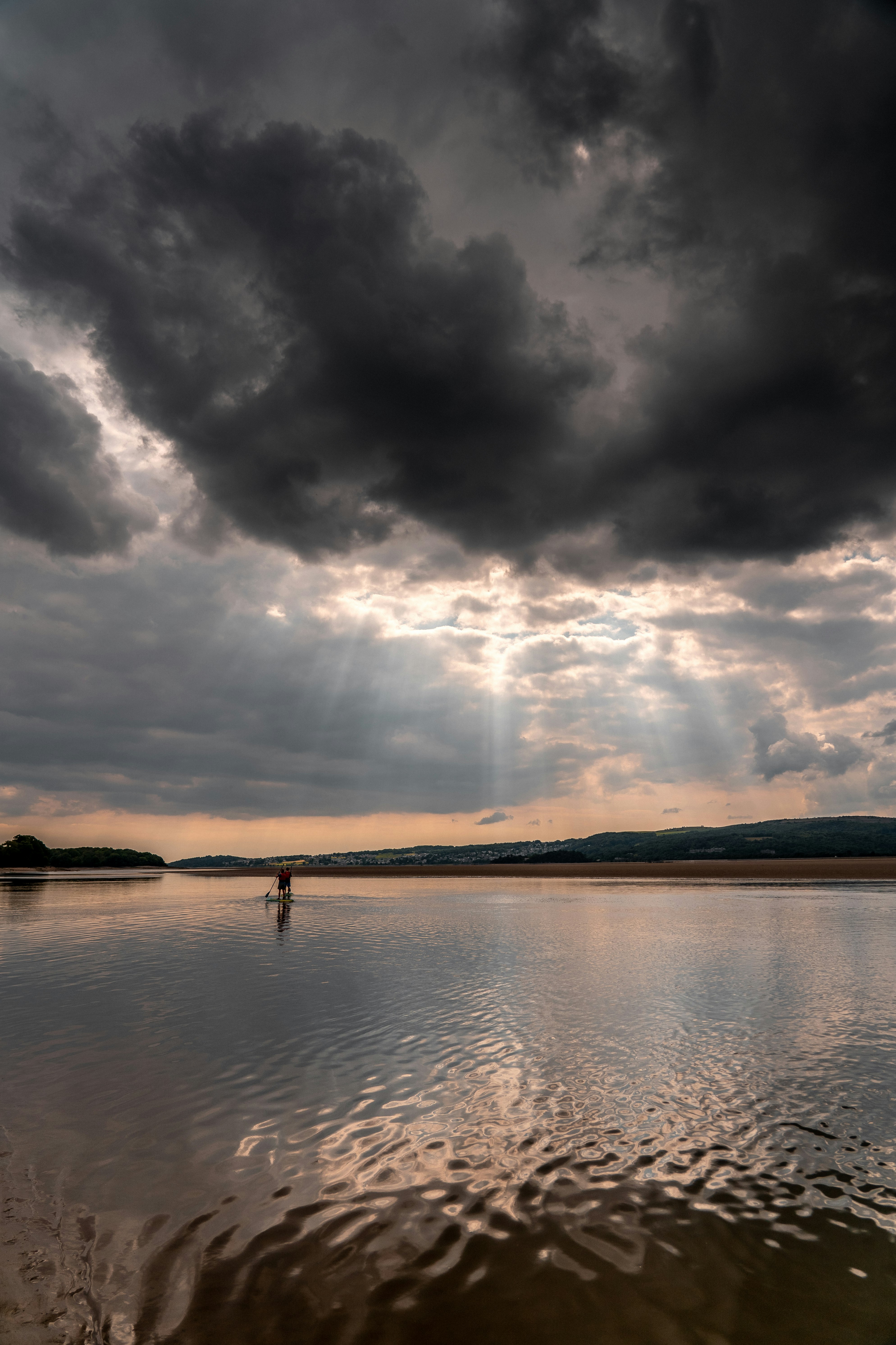 body of water under cloudy sky during daytime