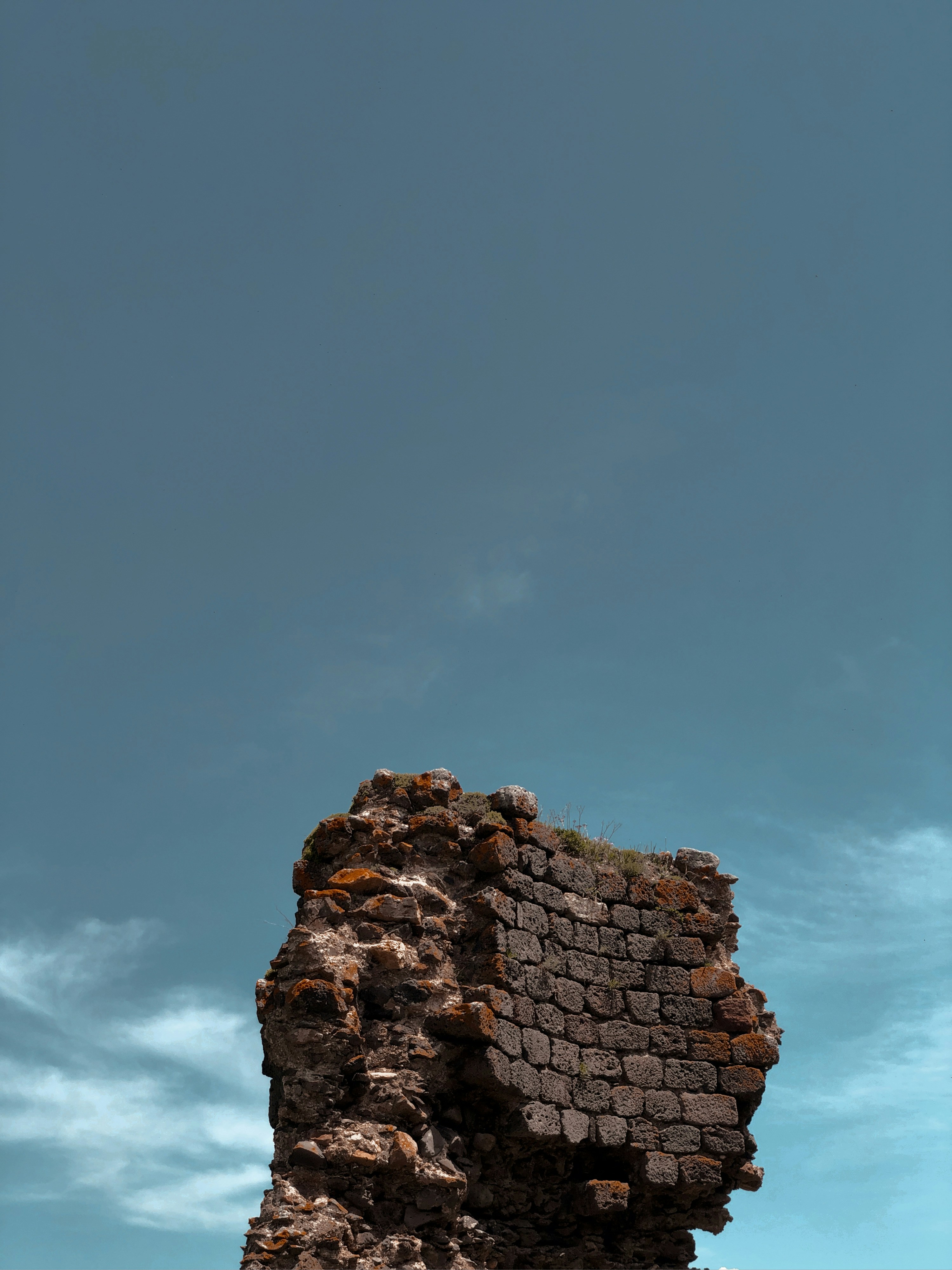 brown rock formation under blue sky during daytime