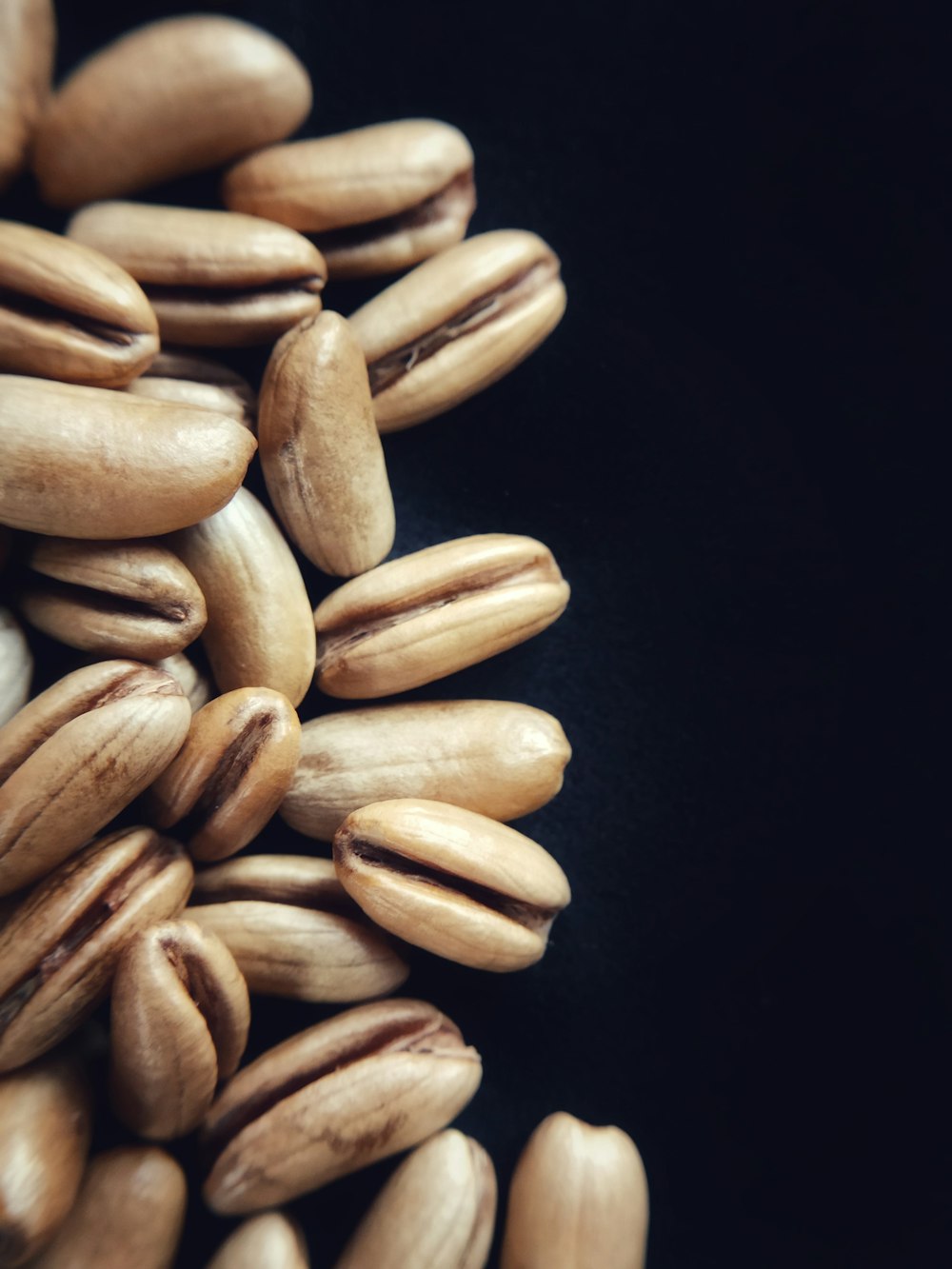 brown beans on black background