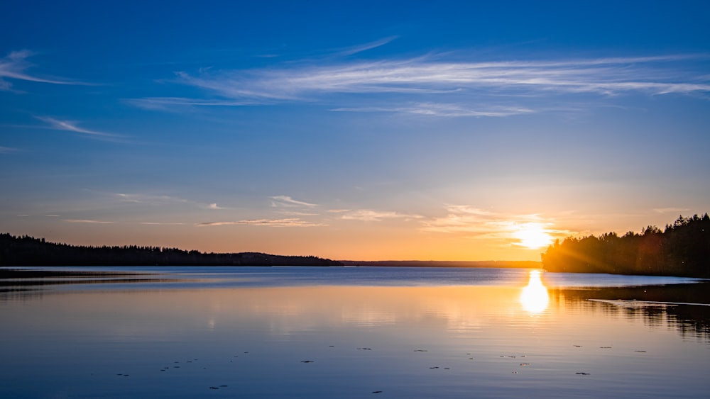 body of water under blue sky during daytime