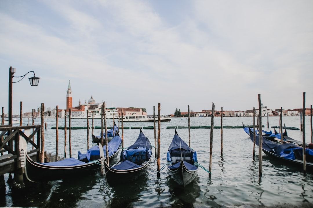 blue and white boat on water during daytime