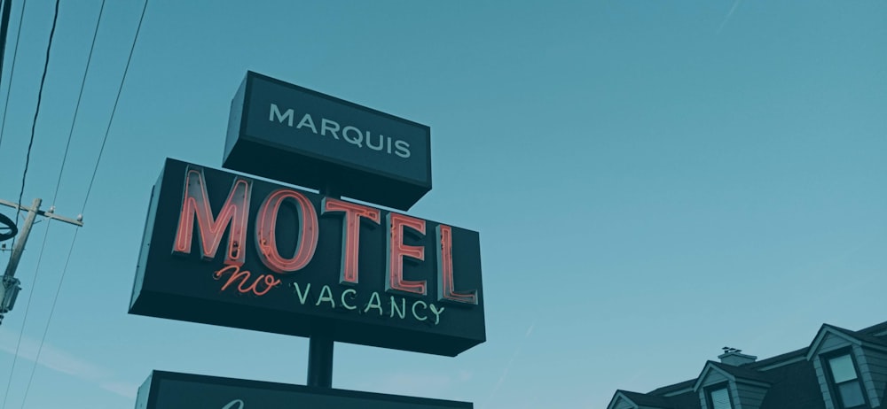 a motel sign in front of a building