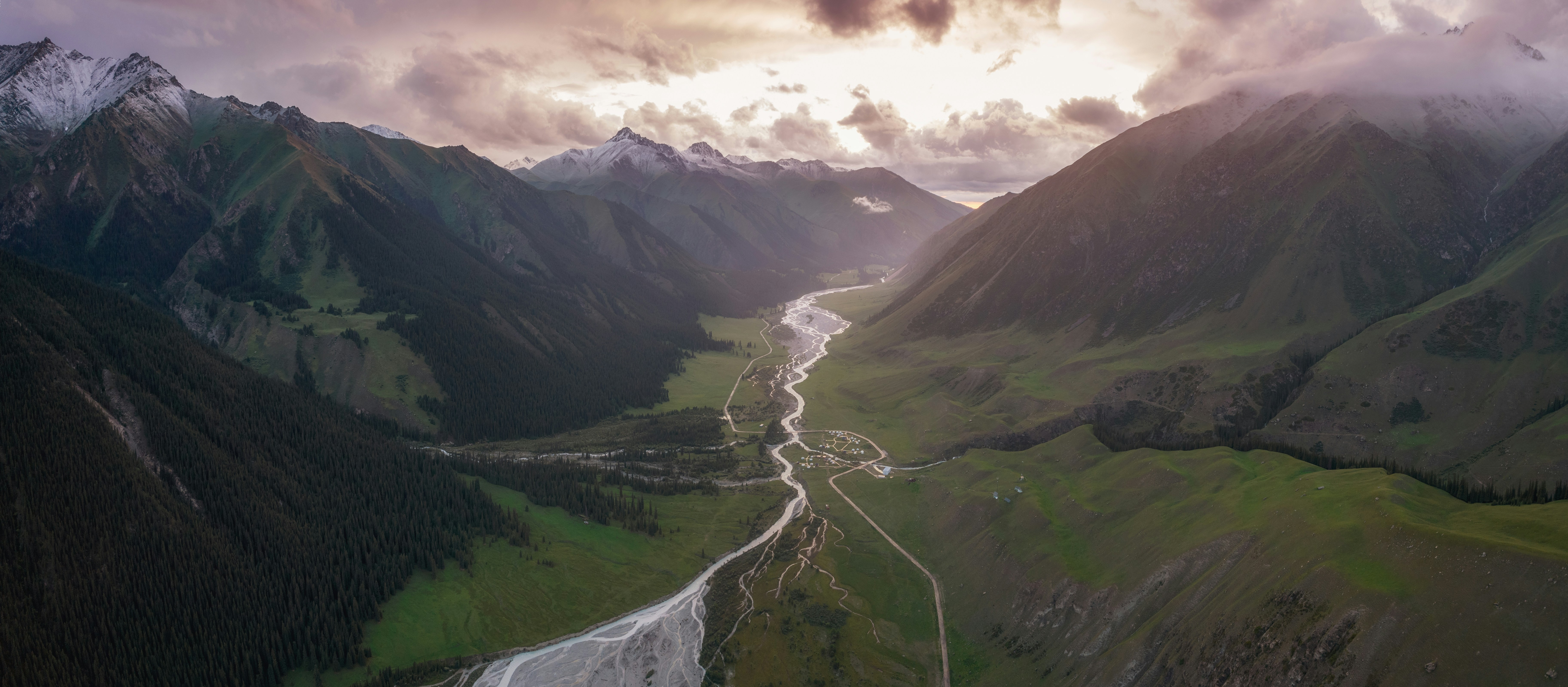 green grass field and mountains under white clouds, 夏塔古道 Sunset drone shot