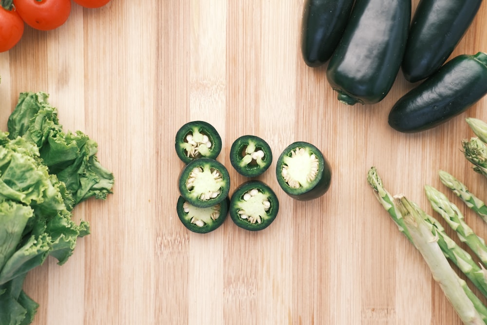 green cucumber on brown wooden table