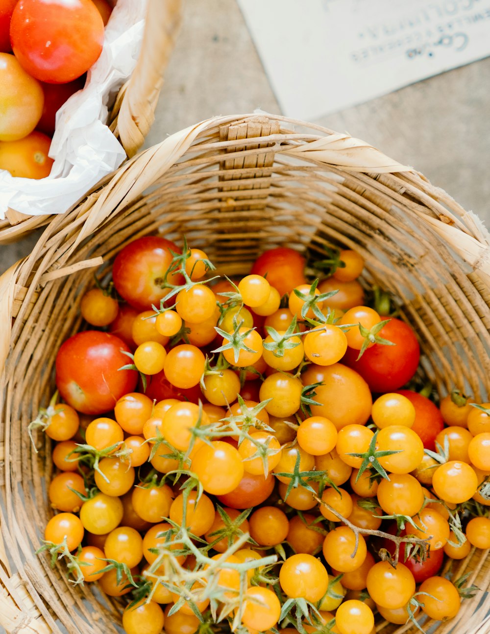 orange fruits in brown woven basket