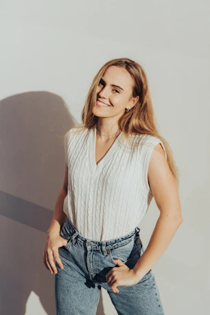 woman in white tank top and blue denim shorts