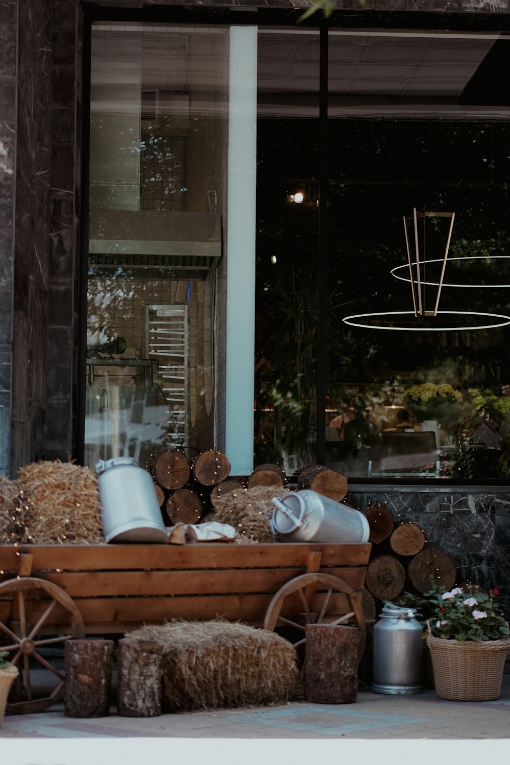 man and woman sitting on brown wooden chairs