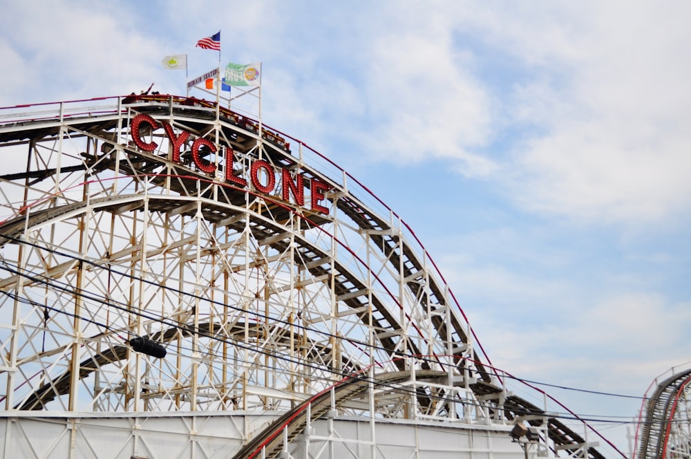 white and red ferris wheel under blue sky during daytime