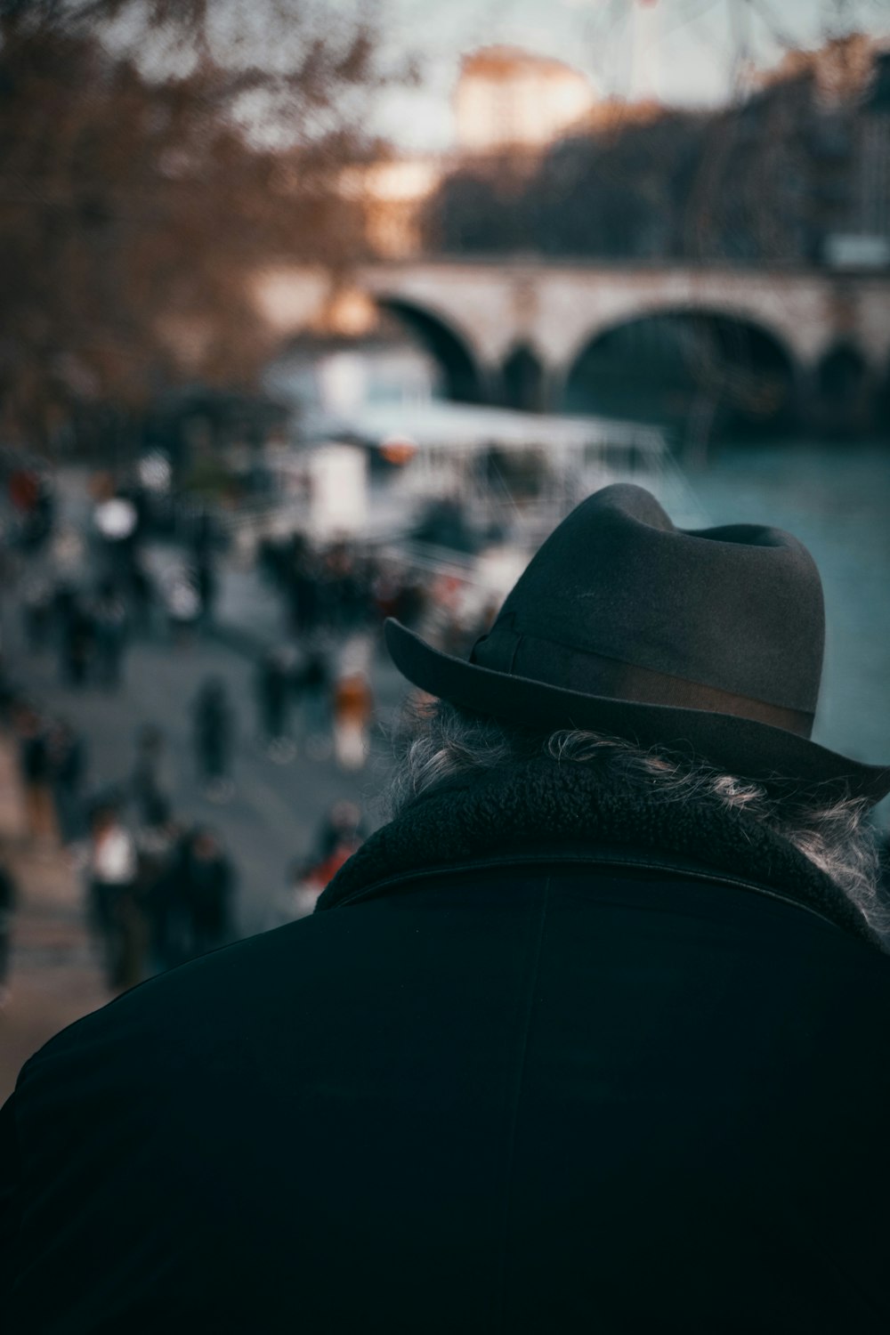 people in black and white hat walking on street during night time