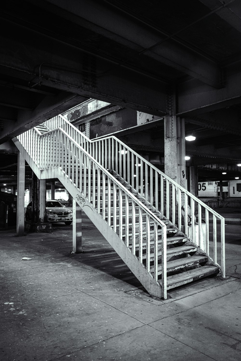 grayscale photo of concrete bridge