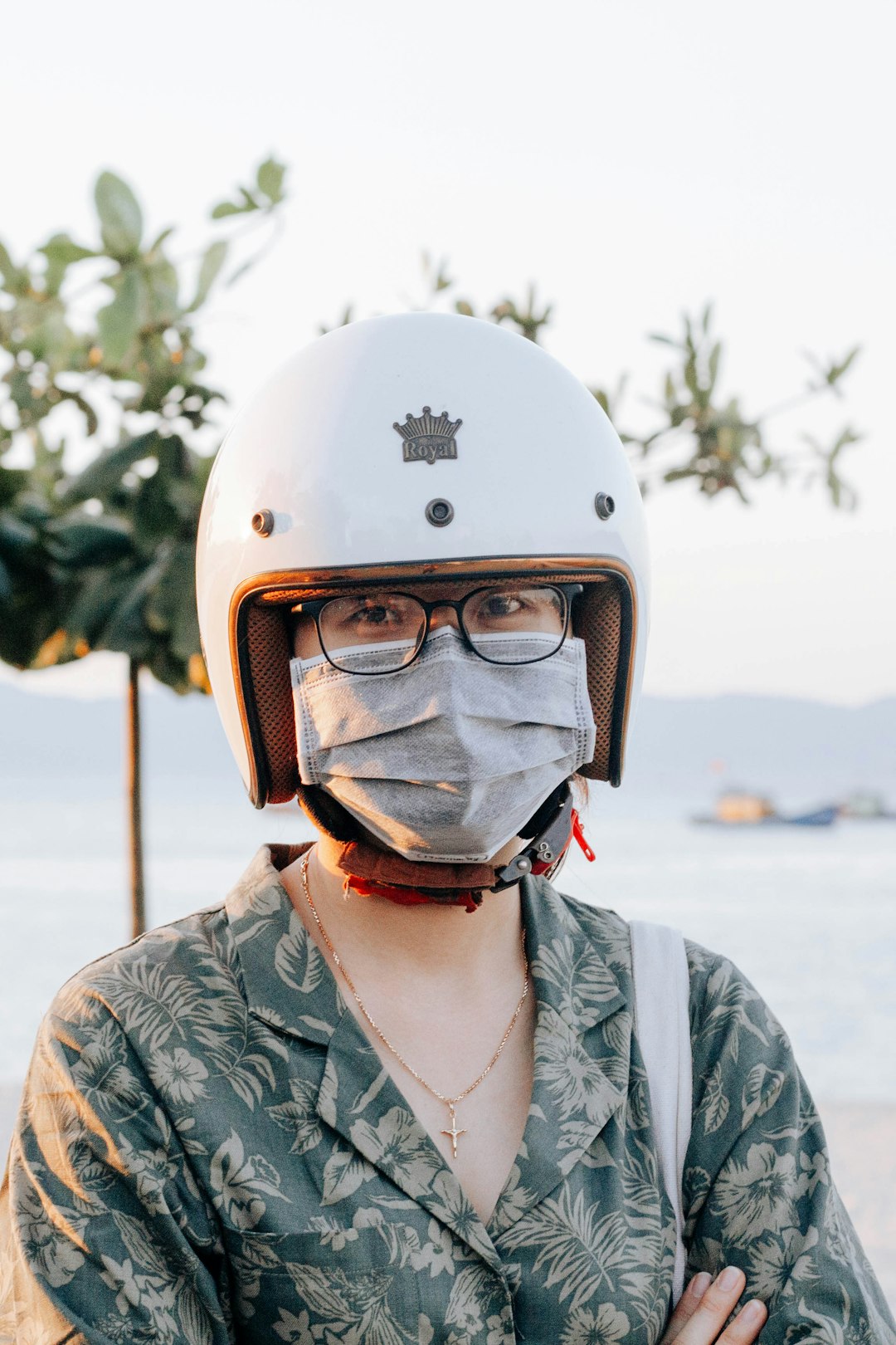 person wearing white helmet and green jacket