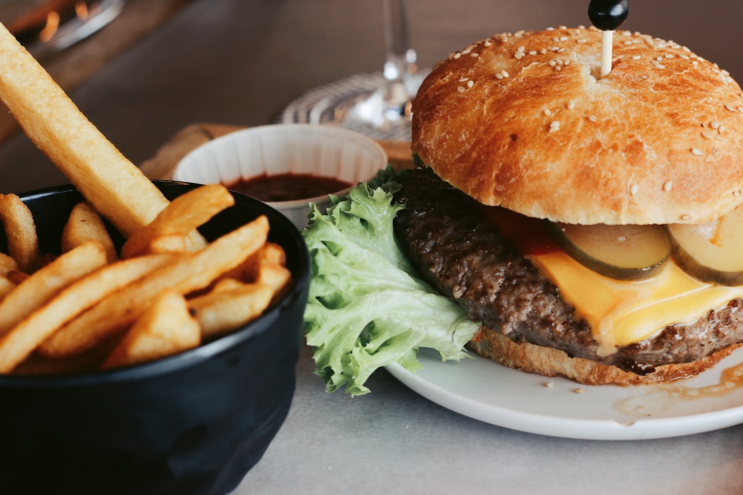 burger with fries on plate