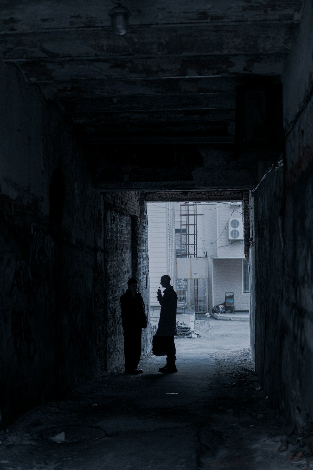 silhouette of man walking on hallway