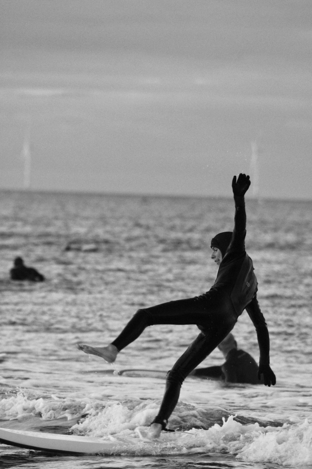 woman in black dress on water