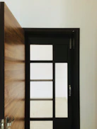 black wooden framed glass door