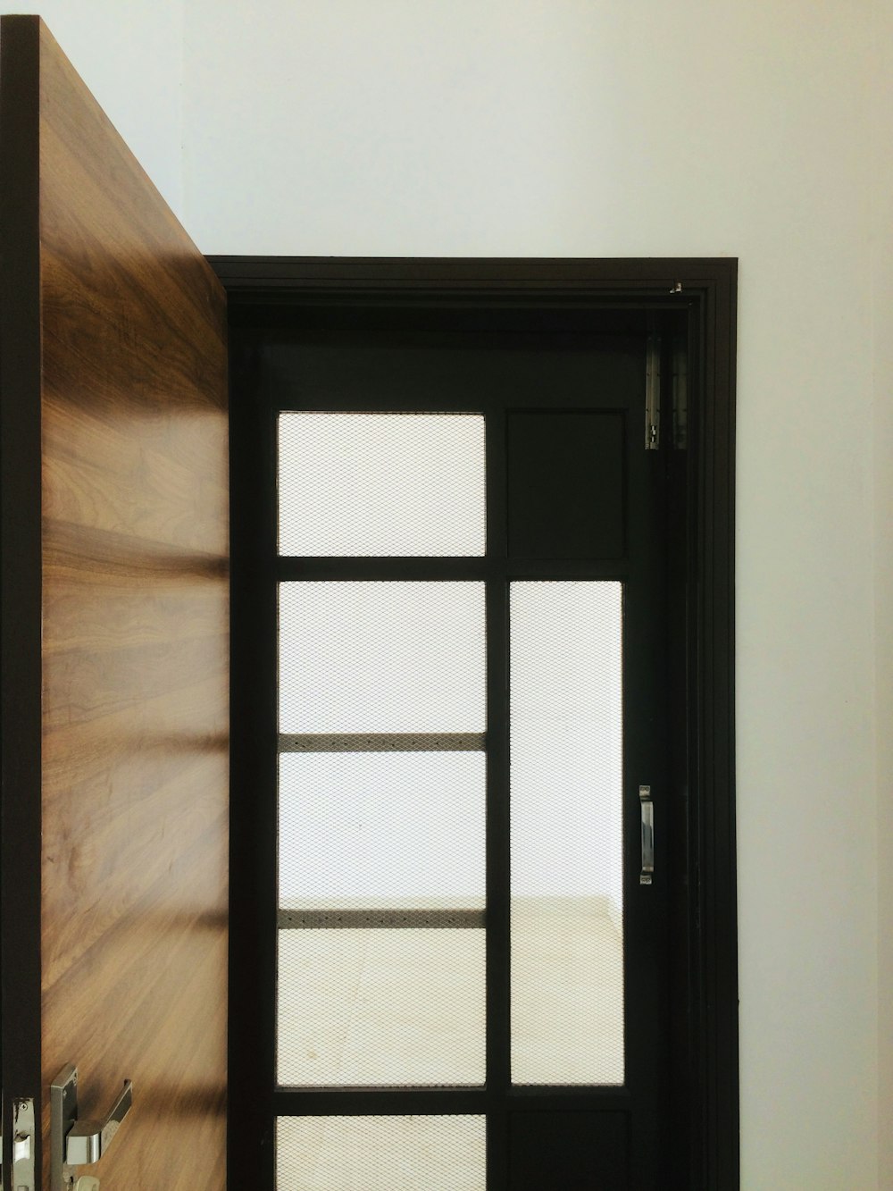 black wooden framed glass door