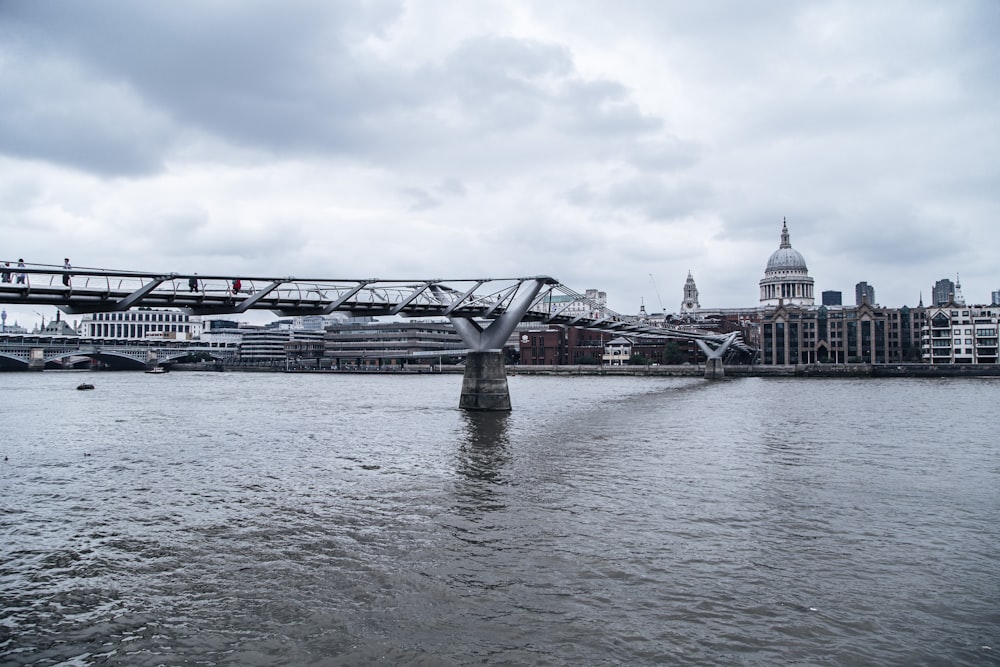 gray bridge over body of water during daytime