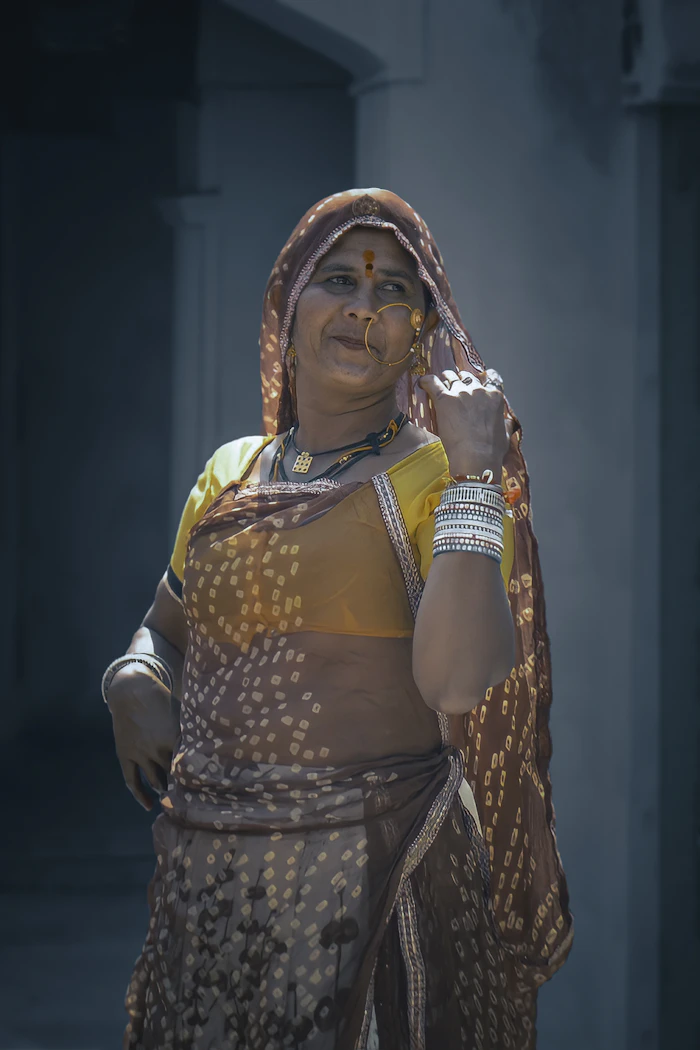 Illustrative stock portrait — Woman in yellow and brown traditional dress